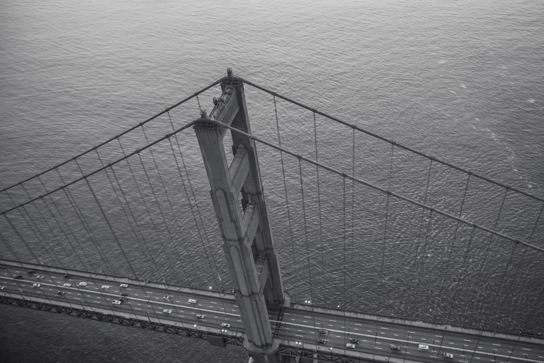 Monochrome aerial view of a suspension bridge — stock photograph