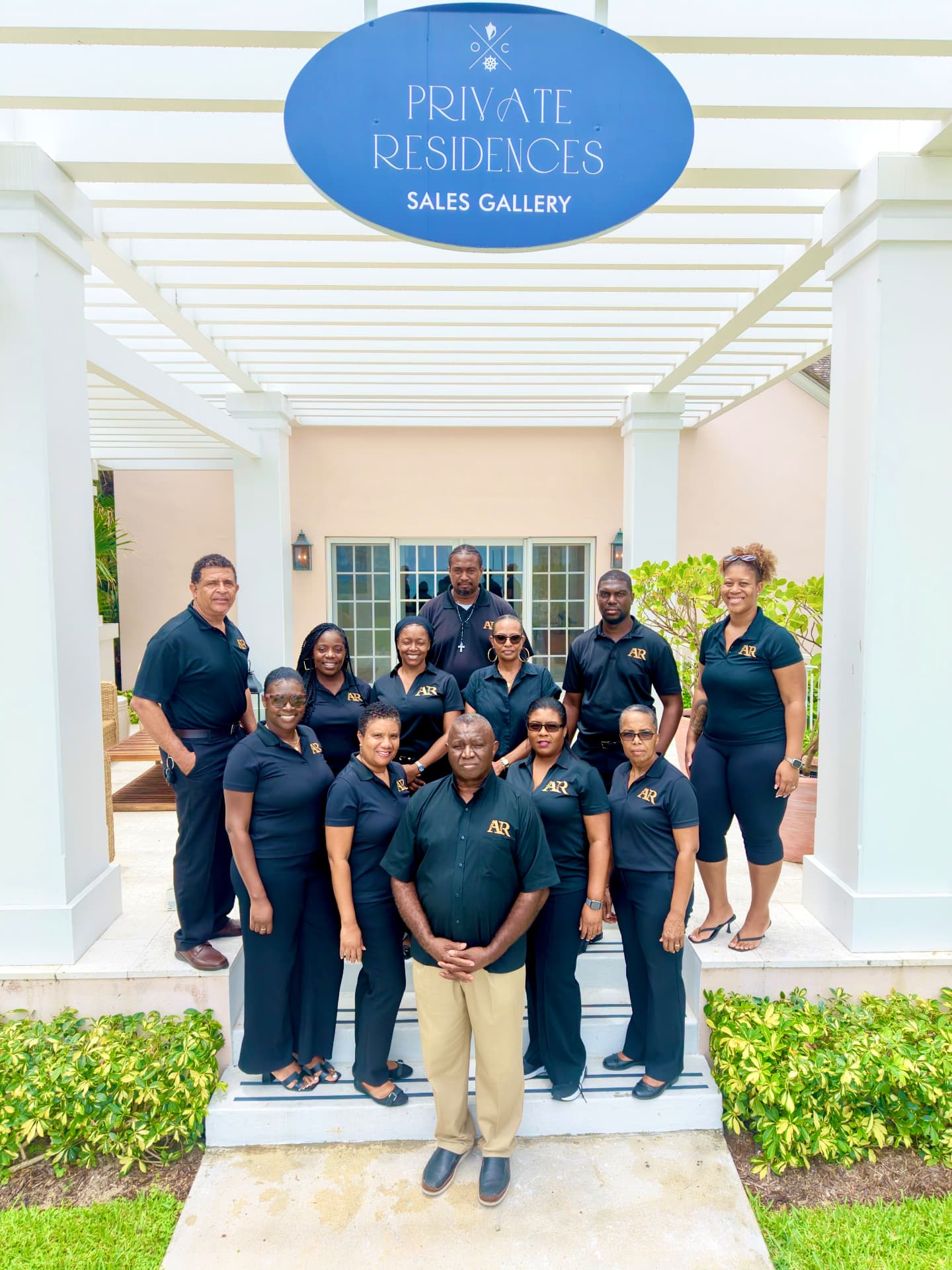 Group portrait outside a private residences sales gallery